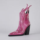 Pink cowboy boot with rhinestone design on a white background