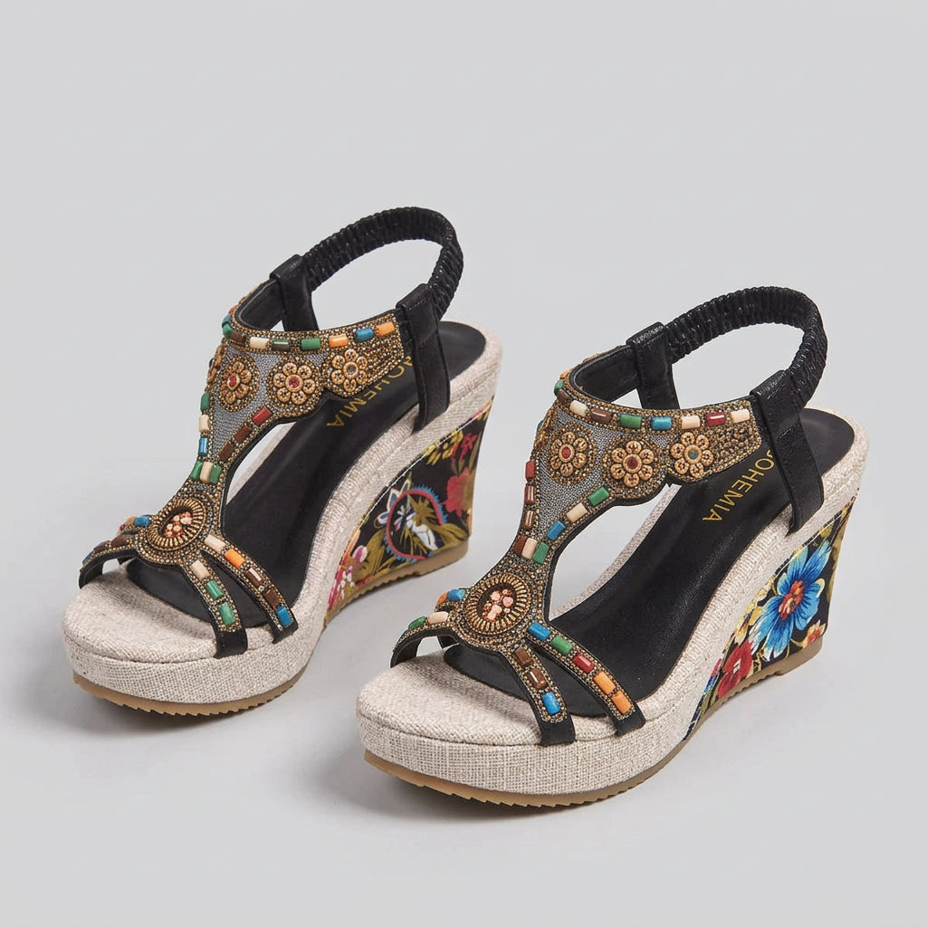 Colorful embroidered wedge sandals on a neutral background